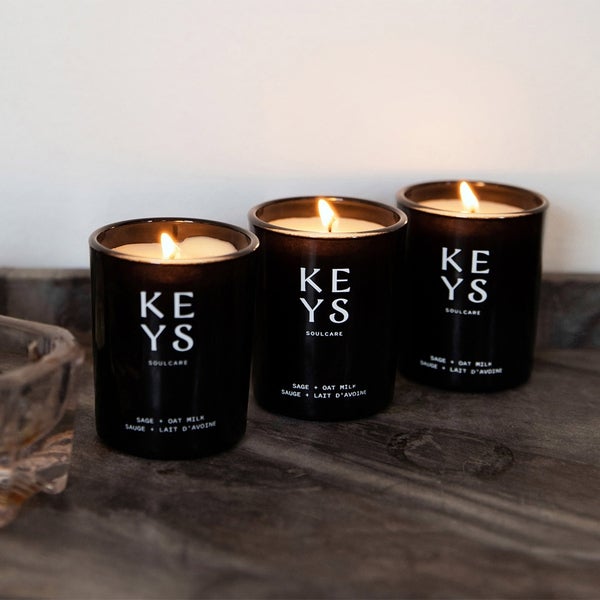 Candle Set Lit and Sitting on a Surface